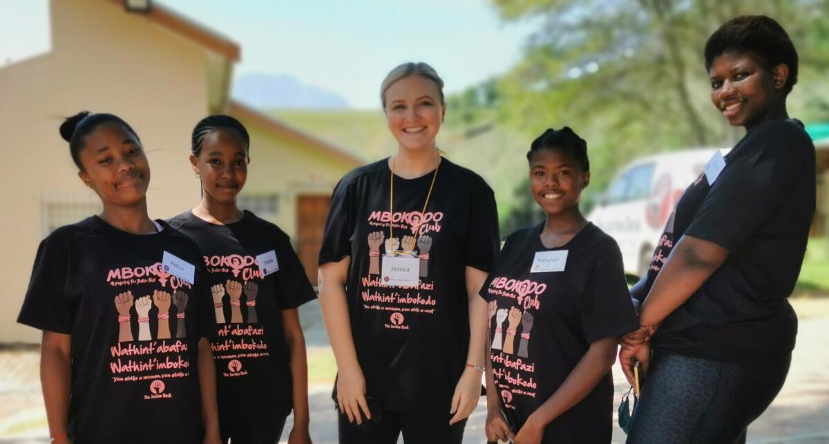 Jessica pictured (centre) with beneficiaries of The Justice Desk