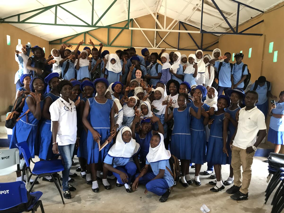 Abigail pictured with the beneficiaries of the Girls Empowerment Project, Sierra Leone