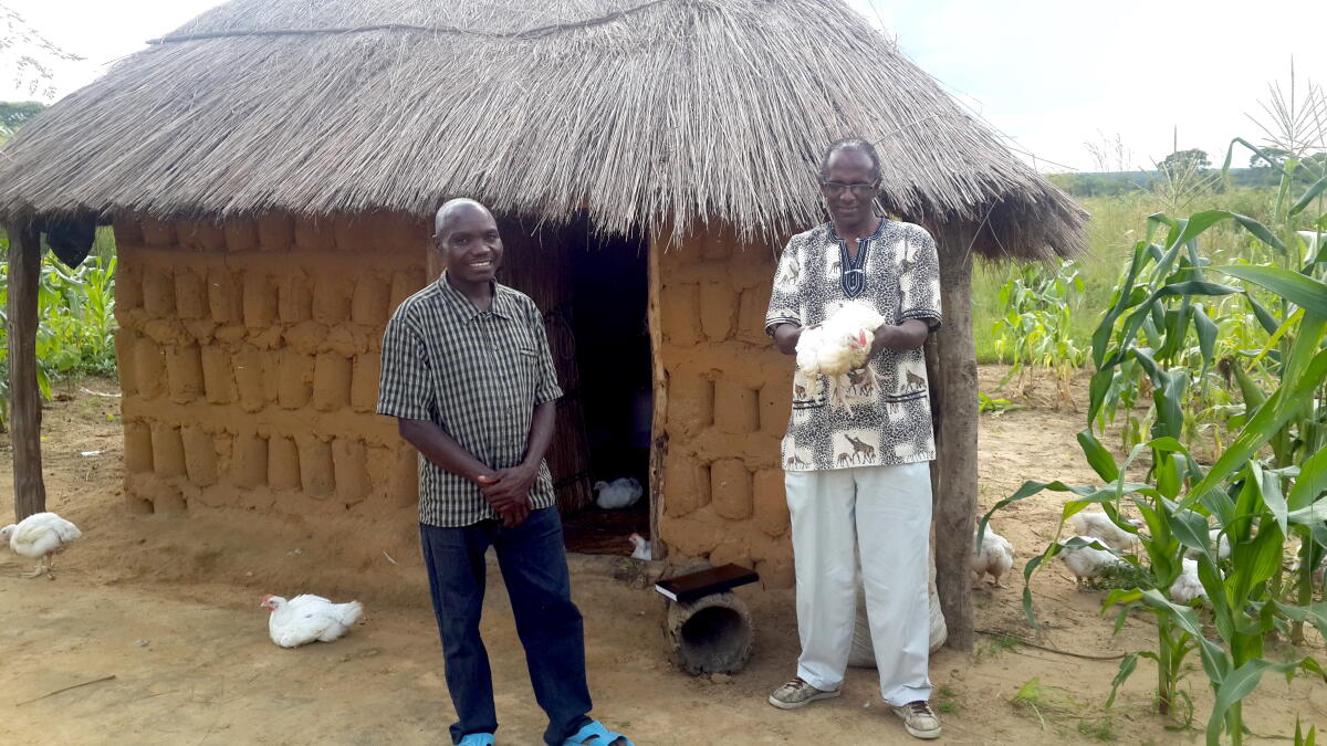 Martin, Right, pictured with a Farmer in Luampa