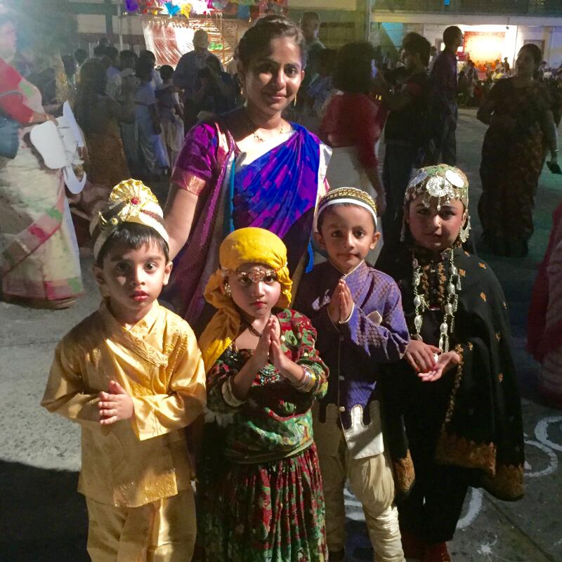 Pictured right: Jenni Barrett presents Br Pat Madigan, Community Leader of Edmund Rice House, with framed commemorative silk from the Edmund Rice Beyond Borders Congress.  Pictured below: Staff, pupils and parents in ceremonial dresses at EREBB Opening Ceremony and Ritual